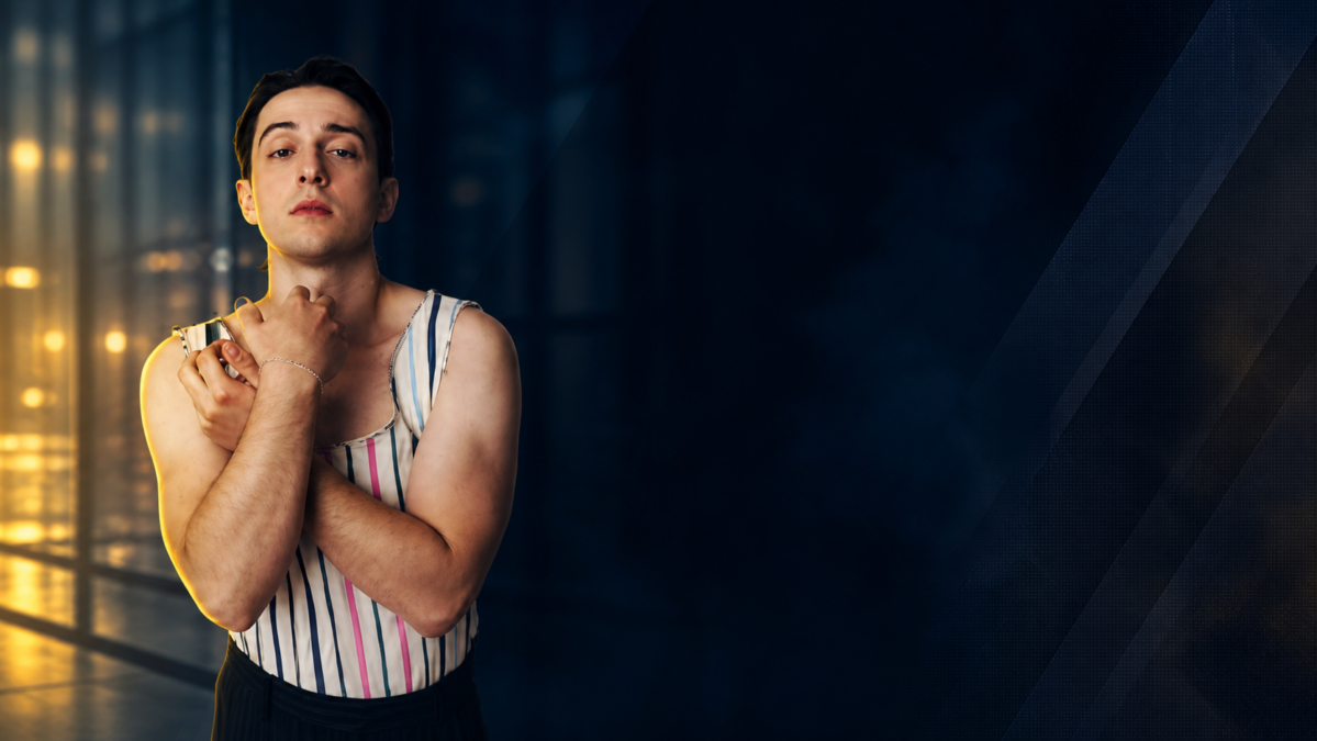 Portrait of a young man in a striped sleeveless top posing against a modern edited background for an article cover.